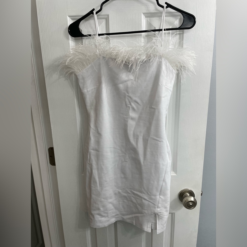 White dress with feather trim